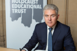 Brandon Lewis signing the Holocaust Book of Commitment