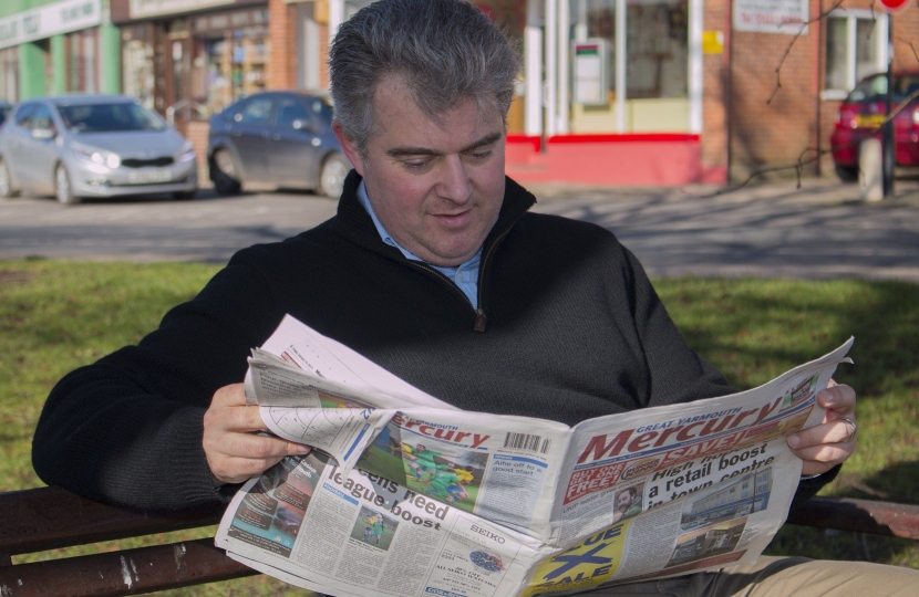 Brandon Lewis taking time out to read the Great Yarmouth Mercury
