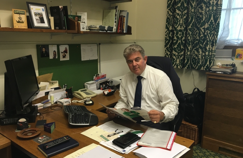Brandon Lewis working in his office