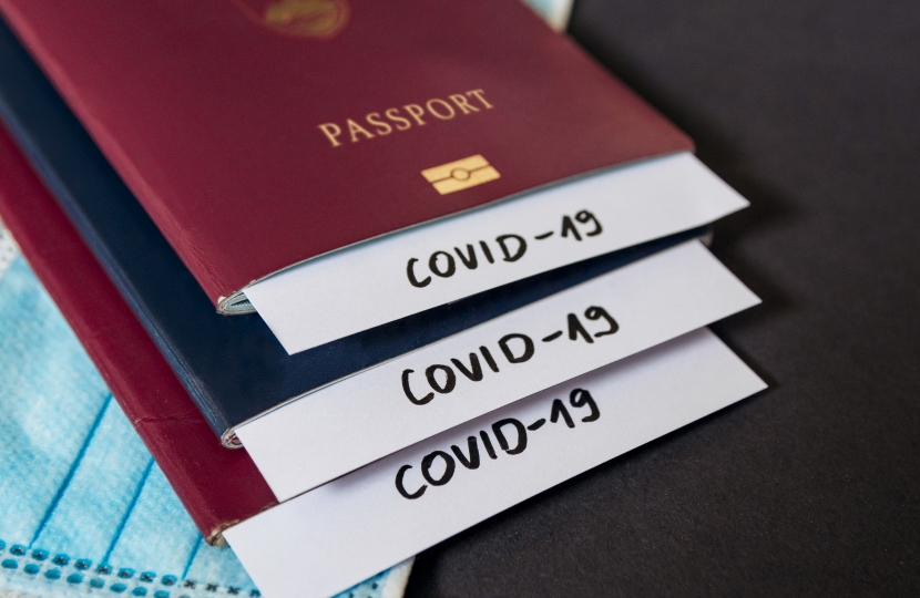 Stack of passports with covid-19 notes