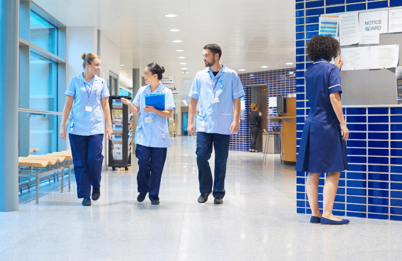 Medical staff walking through a hospital