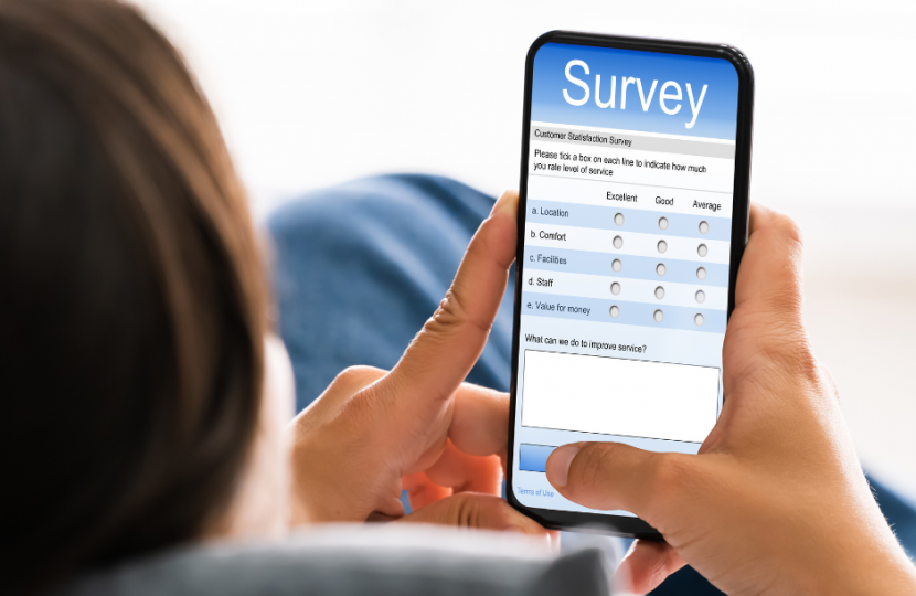 Someone completing an online survey on a smartphone