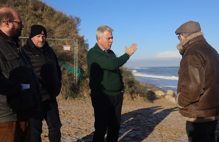 Brandon Lewis MP discussing coast erosion at Hemsby