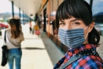 Young woman wearing face covering