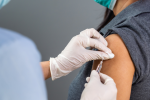 Doctor administering Covid-19 vaccine