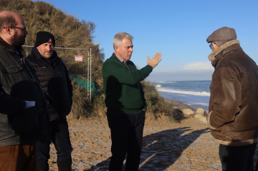 Brandon Lewis MP discussing coast erosion at Hemsby